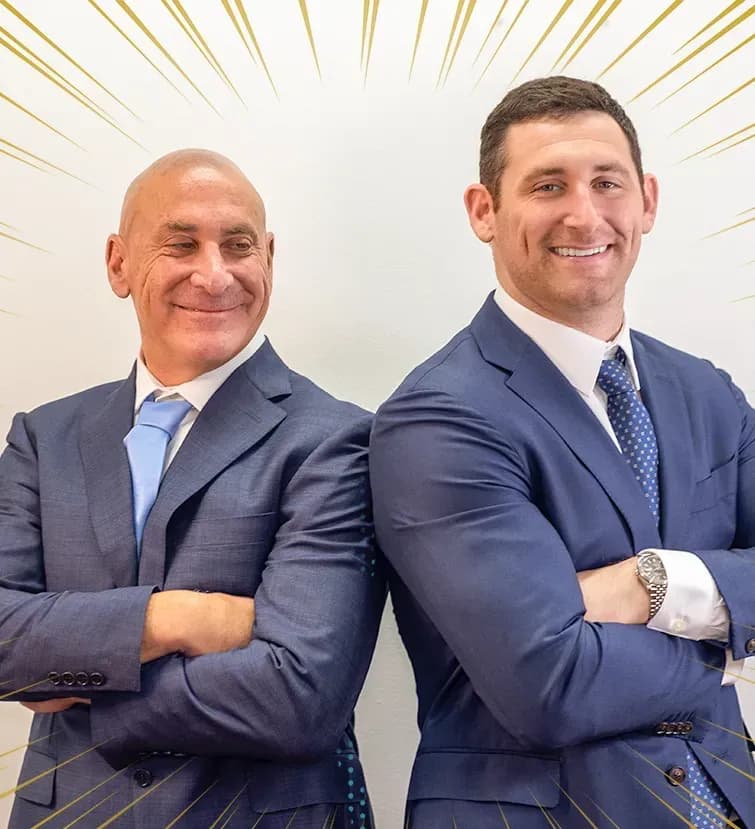 Personal injury lawyers Alex Senft and Scott Senft smiling